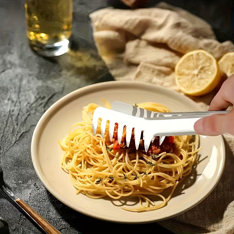 Stainless steel pasta tongs, suitable for buffets and family meals, durable.