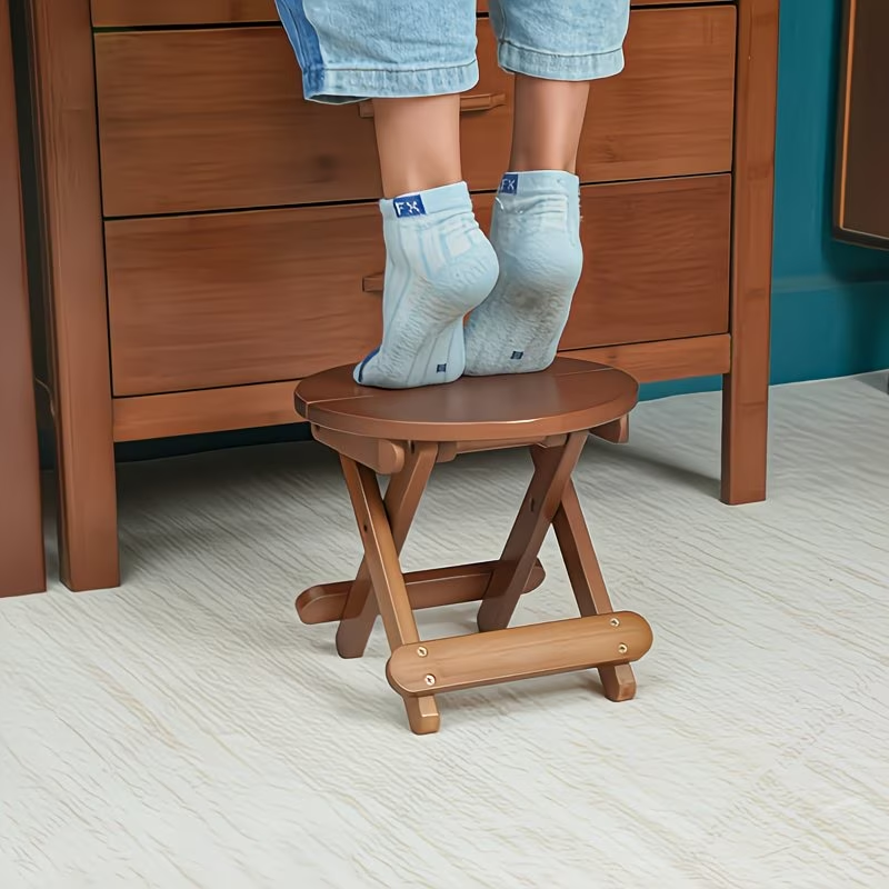 A portable folding round stool, suitable for travel, fishing, leisure, and bamboo use.