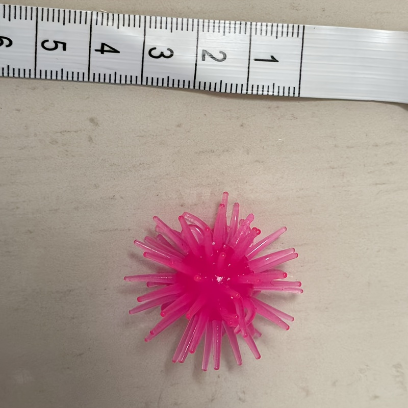 12-pack of interactive cat toy balls with suction cups, made of rubber, no batteries required.