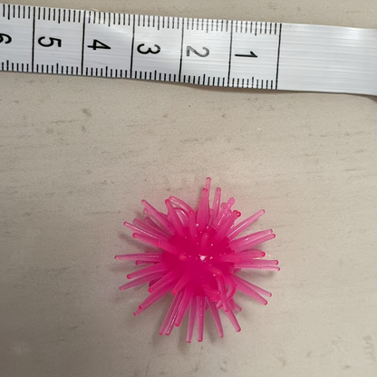 12-pack of interactive cat toy balls with suction cups, made of rubber, no batteries required.